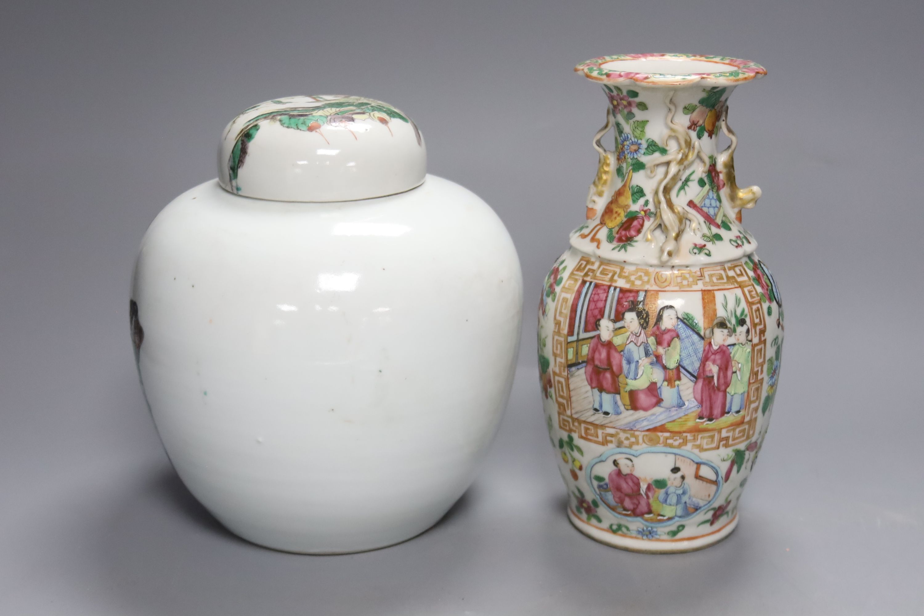 A Chinese famille verte jar and cover and a Canton famille rose vase, tallest 22cm